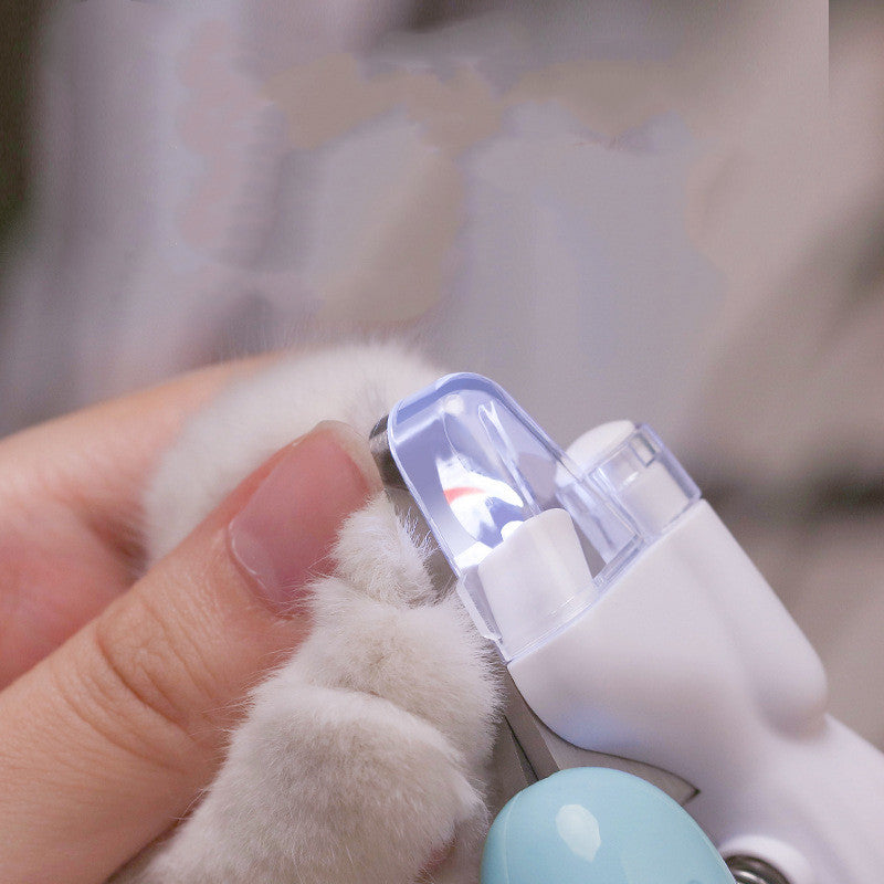 "Pet nail trimming tool in light blue with bright LED for visibility"
